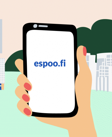 Hand holding a mobile phone with espoo.fi on the screen